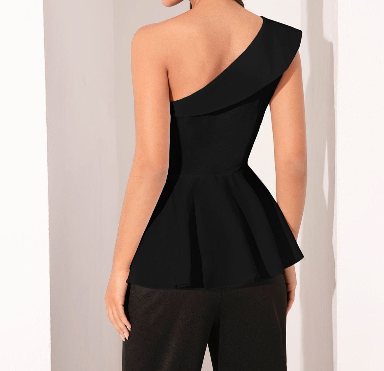 Blusa peplum de un hombro